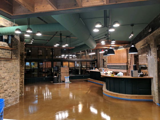 Stained and sealed concrete floor in a restaurant dining room